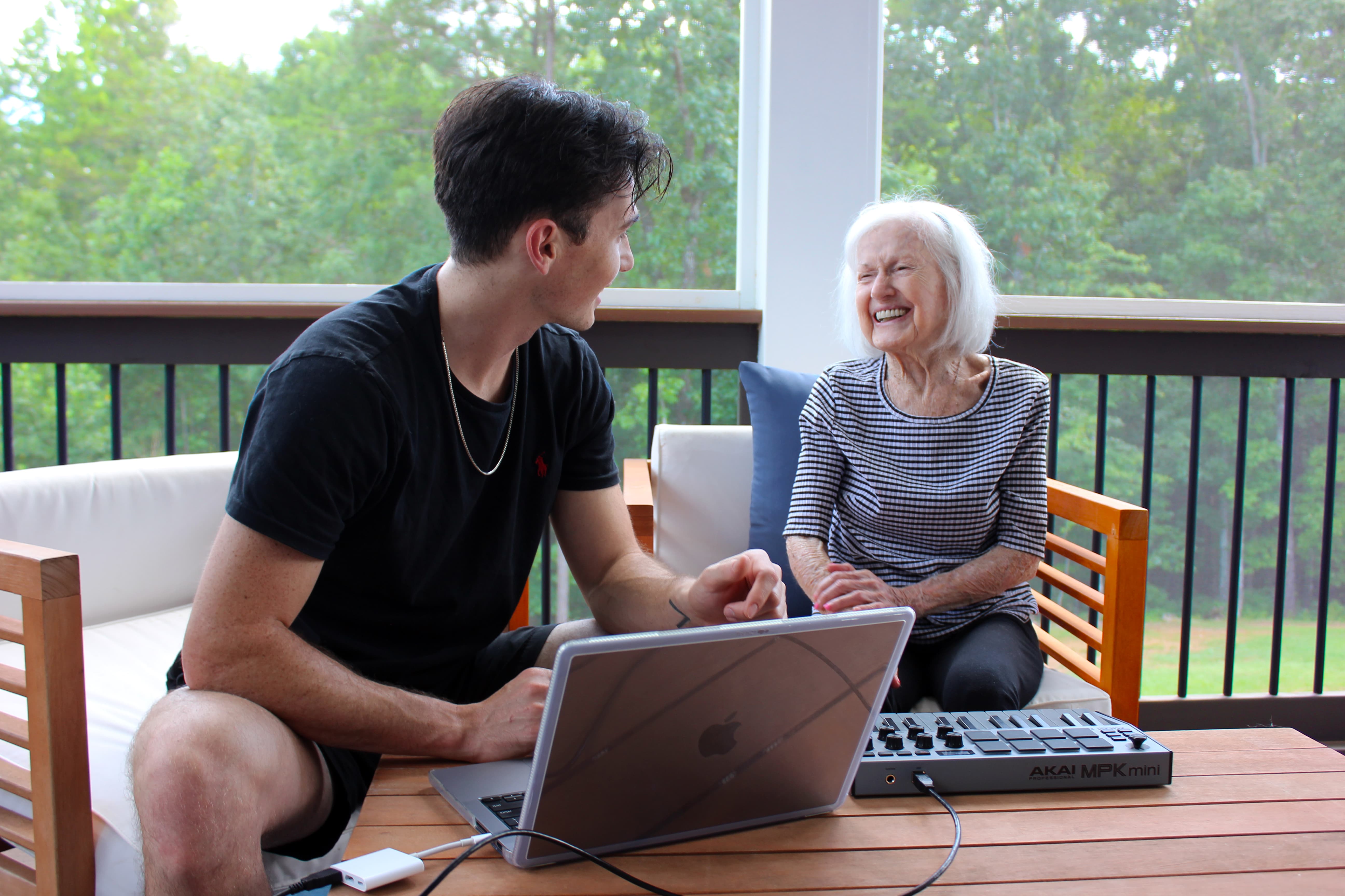 Noah Perales with an older client